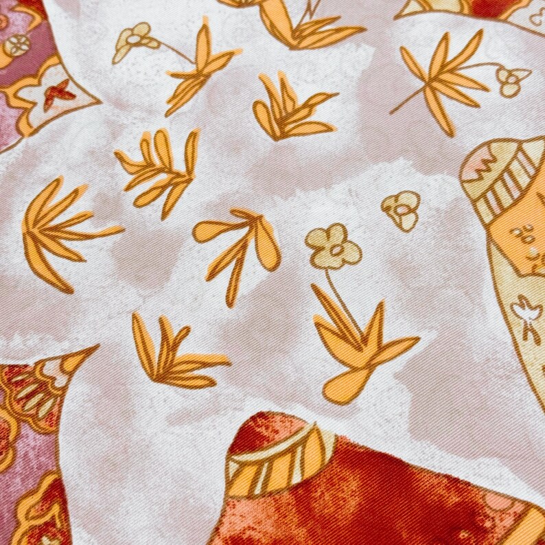 May include: A fabric textile featuring a light gray background with a repeating pattern of golden yellow stylized leaves and small flowers. The design includes sections of deep red and maroon with intricate decorative borders and geometric shapes.