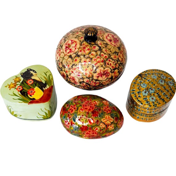 Vintage Kashmiri lacquer boxes hand-painted with intricate floral patterns — a centuries-old artisan tradition you can actually put on your dresser.