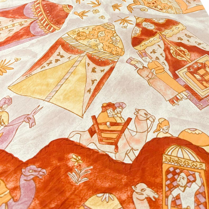 May include: A fabric featuring a repeating pattern of orange and yellow tents, camels, and figures in traditional attire. The design includes stylized floral motifs and architectural elements in shades of orange, purple, and cream on a light background.