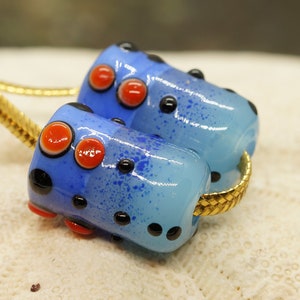 Handmade lampwork bead pair, opaque light blue cylinder, enamel and dot decoration