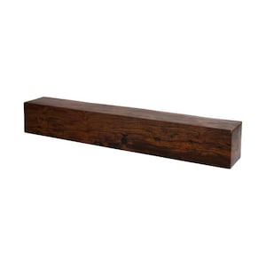 May include: A rectangular, solid wood beam with a rich, dark brown color and visible wood grain. The beam is a long, straight block, likely for construction or decorative purposes. The wood has a natural, textured appearance.