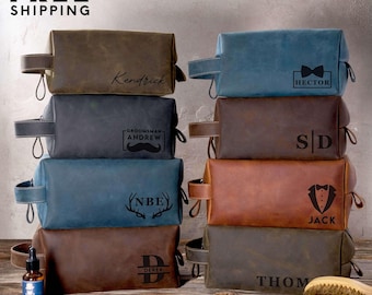 May include: A stack of leather toiletry bags in various colors, including brown, blue, and gray. Each bag is personalized with names or initials. The bags have a handle and a zipper closure. The text "SAME DAY FREE SHIPPING" is at the top.