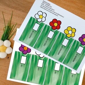 May include: Two white paper sheets featuring a green grass pattern, white rectangular boxes, and colorful flower illustrations. The text includes "BIST GROSSARTIG," "BIST EIN SCHATZ," "BIST UNBEZAHLBAR," "BIST WUNDERBAR," and "BIST" repeated four times.