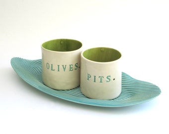 olives and pits  ...  hand built porcelain containers  ...  serving vessels