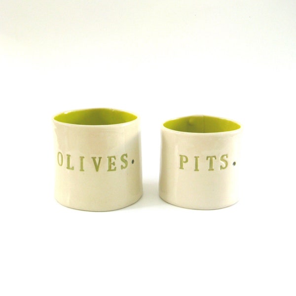 olives and pits  ...  hand built porcelain containers ...  vessels