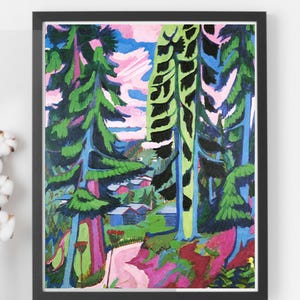 May include: A framed abstract landscape painting featuring tall green and blue trees with black accents. The artwork includes a pink path, blue sky, and small buildings, creating a vibrant forest scene. The painting is in a black frame.