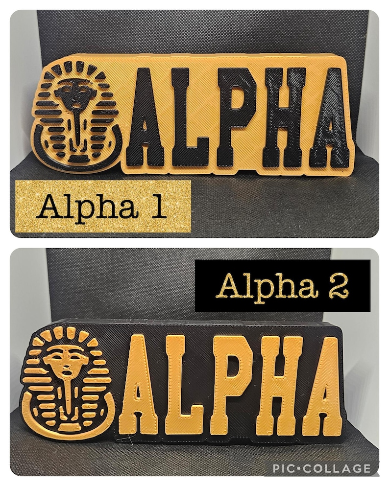 May include: Two versions of a black and gold wooden sign with the word "ALPHA" in gold letters. The sign also features a gold Egyptian pharaoh head with a cobra on the left side.