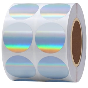 May include: Roll of iridescent silver round stickers. The stickers are arranged in rows on a white backing.