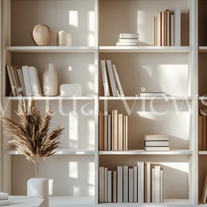 May include: A white bookshelf with multiple shelves filled with books, decorative objects, and dried flowers. The bookshelf is against a white wall and has natural light shining through the window.