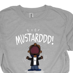 May include: Gray t-shirt with a cartoon character with a large mouth and the text "MUSTARDDD!" printed on it.