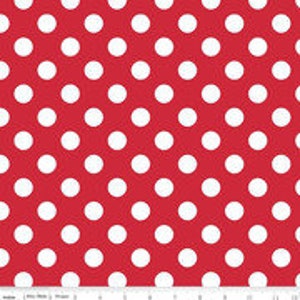 May include: Red fabric with a white polka dot pattern.