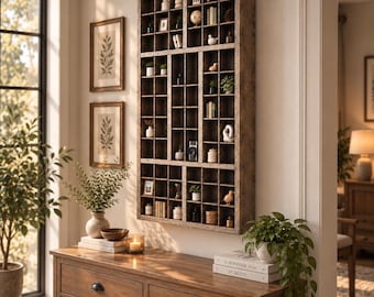 May include: A large, rectangular, dark wood wall-mounted display shelf featuring numerous small, square compartments of varying sizes. The grid-like structure is filled with various miniature decorative objects, including small figurines, books, and plants.