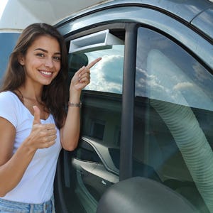 May include: A white rectangular plastic air vent insert installed in the top edge of a vehicle window frame, featuring a hollow opening for airflow, positioned alongside a flexible ribbed hose extending from the interior of the vehicle cabin.