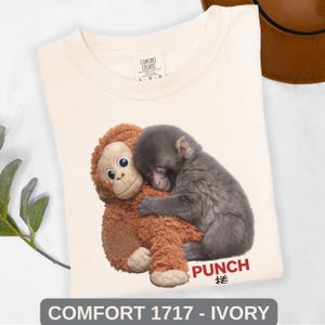 Close up of adorable baby monkey graphic tee with emotional animal lover design