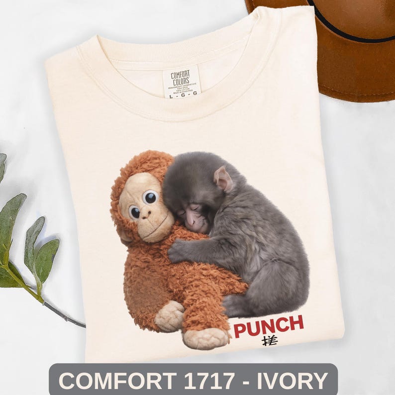 Close up of adorable baby monkey graphic tee with emotional animal lover design