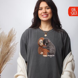 Monkey lover shirt featuring heartwarming baby monkey cuddle scene