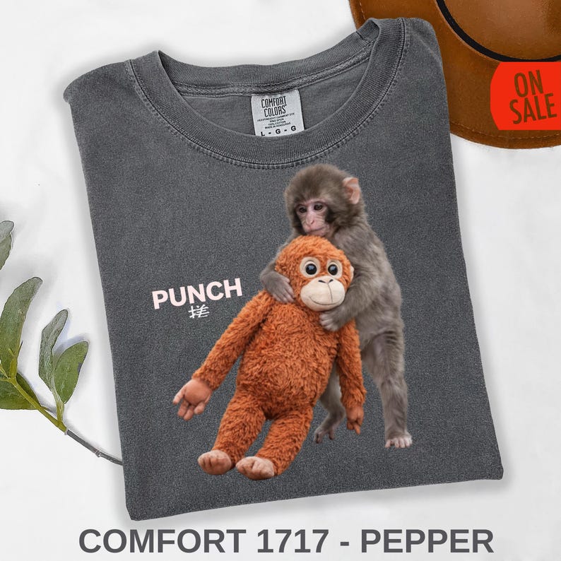 Meme monkey tee with soft plush toy cuddle scene