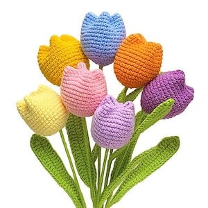 May include: A bouquet of crocheted tulips in various colours, including yellow, orange, pink, purple, and blue. The tulips have green crocheted stems and leaves.