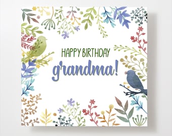 May include: A square greeting card with a white background, featuring the text "HAPPY BIRTHDAY grandma!" in green and blue. The card is decorated with watercolor illustrations of colorful flowers, leaves, and two birds.