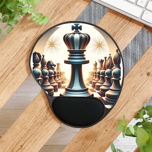 May include: Black and gray ergonomic mousepad with a chess-themed design. The image features a detailed illustration of a chess set, with a prominent king piece in the center. The mousepad has a built-in wrist rest for added comfort.