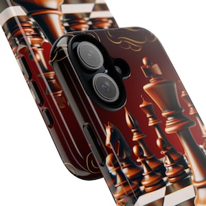 May include: A smartphone case featuring a chess board design. The case has a dark red background with a chess set illustration in shades of brown and gold. The phone's camera lenses are visible.