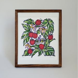 May include: Framed art print featuring a vibrant illustration of raspberries and foliage. The artwork includes red raspberries, green leaves, and yellow flowers. A small scene of people is visible in the background. The print is framed in a dark brown wooden frame.
