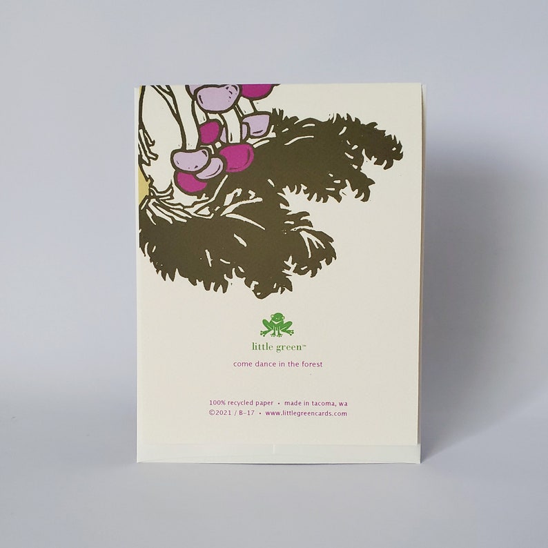 May include: A green frog illustration with the text "little green" and "come dance in the forest". The text below reads "100% recycled paper made in Tacoma, WA &copy;2021/8-17 www.littlegreencards.com".