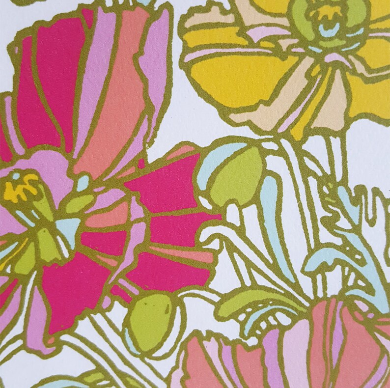 May include: A white background with a floral pattern featuring pink, yellow, and green flowers. The flowers are stylized and have a retro look.