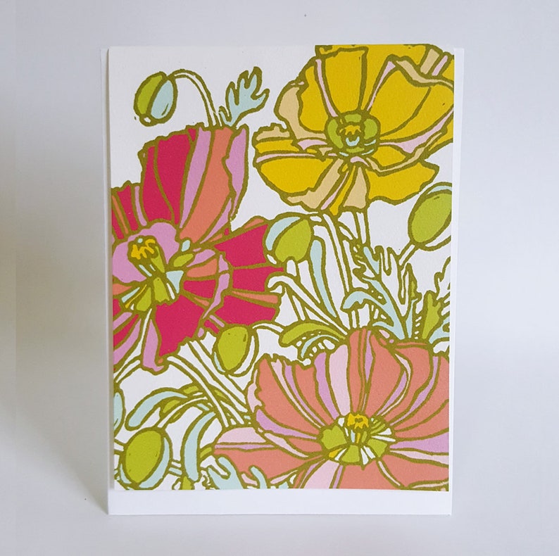 May include: A floral illustration featuring pink, yellow, and green poppies with white outlines. The flowers are arranged in a bouquet with stems and leaves.
