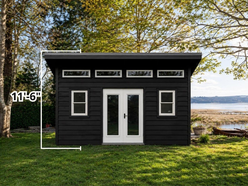 May include: A black shed with white trim, featuring double doors, two rectangular windows, and a row of four clerestory windows. A white graphic line indicates a height measurement of 11 feet 6 inches along the side of the structure.