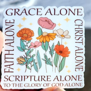 May include: White sticker with a floral design and the text "Grace Alone, Faith Alone, Christ Alone, Scripture Alone, To the Glory of God Alone".
