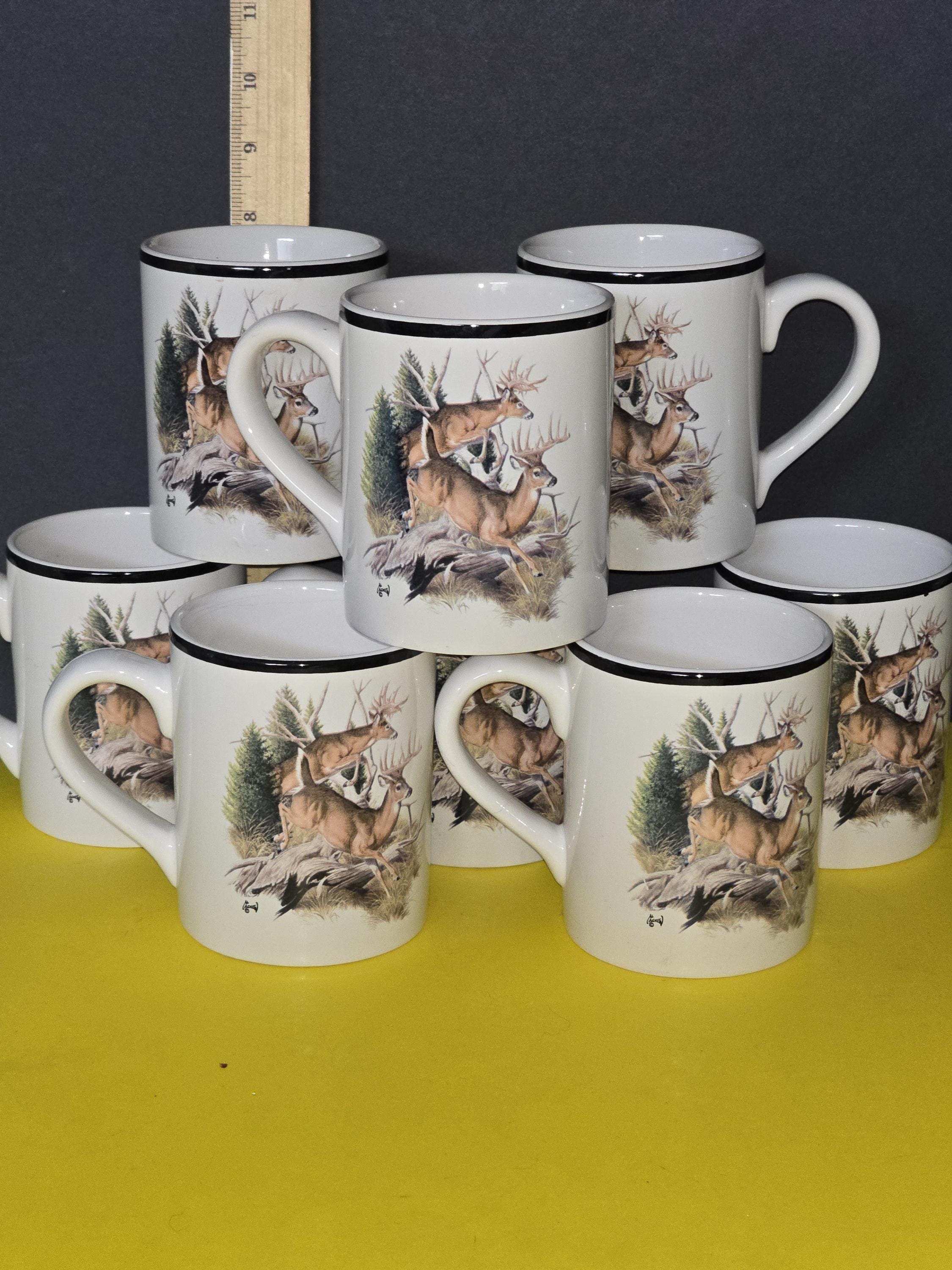 Collectible Al Agnew coffee mugs featuring stag design