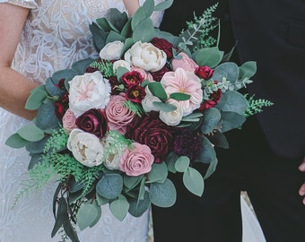 Burgundy and blush sola wood bridal bouquet with faux eucalyptus and ferns, coordinating bridal party boutonnieres, bouquets, and corsages.