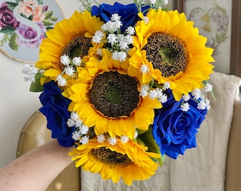 Royal blue roses, sunflowers, and baby's breath bouquet wrapped in burlap. In stock and ready to ship.