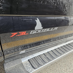 Godzilla vinyl sticker decal multi color, 7.3L Godzilla vinyl perfect for vehicles with the 7.3L Godzilla engine, comes in a set of 2!