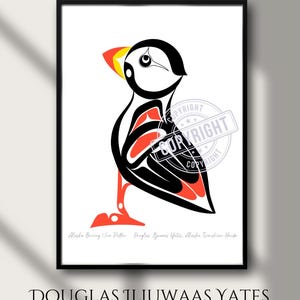 May include: A framed print titled BERING SEA PUFFIN by Douglas Iljuwaas Yates Alaska Tsimshian Haida. The artwork features a stylised black, white, and red puffin illustration with bold lines. The text BERING SEA PUFFIN and the artist name appear.