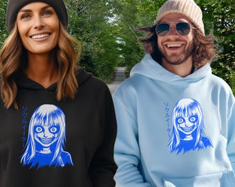 Anime Grinning Woman T-Shirt Hoodie: Japanese Text, Blue Line Art, Scary