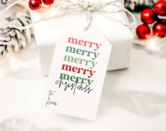 May include: A white rectangular gift tag with a hole at the top, tied with string. The tag features the word merry repeated five times in alternating red and green text, followed by the word christmas in black script and to: from: below.