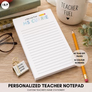 May include: A white rectangular notepad with horizontal black lines, featuring the printed text 'a little note from MS CURRIE' in blue and grey, accompanied by a small yellow pencil graphic at the top, with 40 tear-off pages and 16 colour schemes.