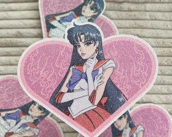 Schimmernder Glitzer Sticker von Sailor Moon zu Sailor Mars in Herzform