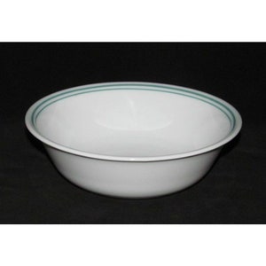 May include: A white ceramic bowl with a green rim and two green stripes around the top.