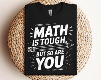 May include: Black t-shirt with white text that reads "Math is tough, but so are you". A white pencil with black eraser is drawn above the text.
