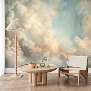 May include: A room with a cloud mural, a wooden coffee table, a floor lamp, and a chair. The mural features a sky with fluffy white and peach-colored clouds against a blue background. The table has a bowl of nuts and a vase with greenery.
