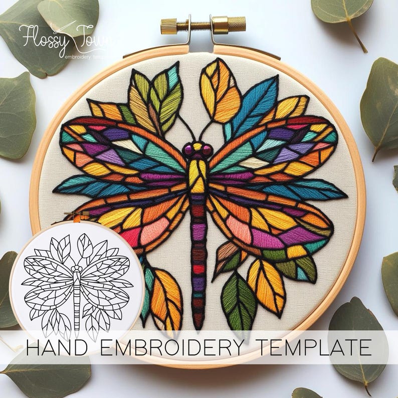 May include: A hand embroidery template featuring a colourful dragonfly with stained glass-like wings surrounded by leaves. The template is printed on white paper and is ready to be used for embroidery.