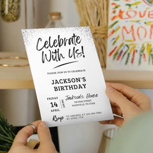May include: A white birthday party invitation with black text. The invitation says "Celebrate With Us!" and includes the details for Jackson's birthday party. The party is on Friday, April 14th at 2:00 PM at Jackson's House. The address is 789 Pine Street, Nashville, TN 37206. RSVP to Amanda at 123-456-7890 by April 7th.