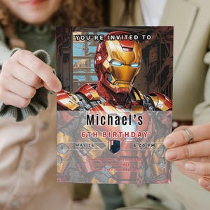 May include: A birthday invitation featuring Iron Man's helmet in gold, red, and yellow. The invitation reads "YOU'RE INVITED TO Michael's 6TH BIRTHDAY" with the date and time. The background has a comic book style.