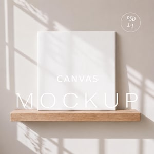 May include: A square white blank canvas mockup resting on a horizontal wooden shelf. The canvas features a textured surface. Text on the image reads "CANVAS MOCKUP" in white capital letters and a small circle with the text "PSD 1:1" in the corner.
