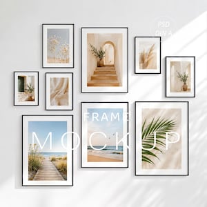 May include: A gallery wall set of nine black frames containing various prints including a beach boardwalk, ocean waves, stone stairs, pampas grass, and palm leaves. The text FRAME MOCKUP and PSD DIN A are overlaid on the image in white lettering.