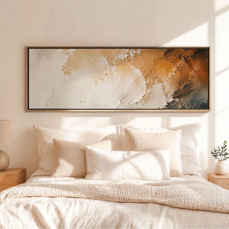 May include: A rectangular wall art piece featuring an abstract landscape with thick, textured impasto paint strokes. The colour palette transitions from creamy white and beige on the left to deep, warm ochre and dark brown tones on the right.