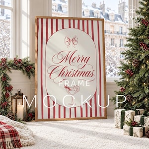 May include: A rectangular wooden frame containing a poster with red vertical stripes and a central oval. The design features a red bow, the text Merry Christmas, and a cocktail glass illustration. The text MERRY CHRISTMAS FRAME MOCKUP is visible.